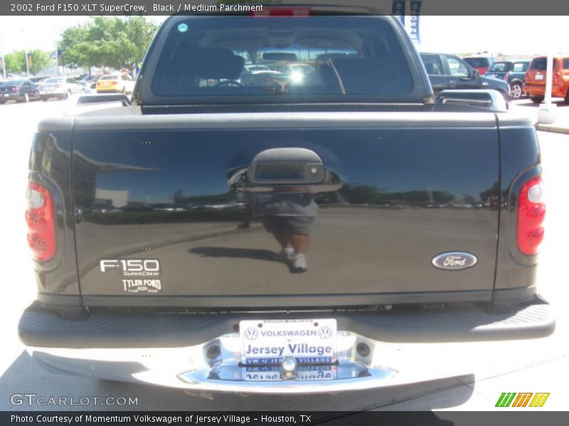 Black / Medium Parchment 2002 Ford F150 XLT SuperCrew
