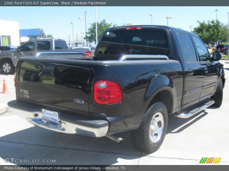Black / Medium Parchment 2002 Ford F150 XLT SuperCrew