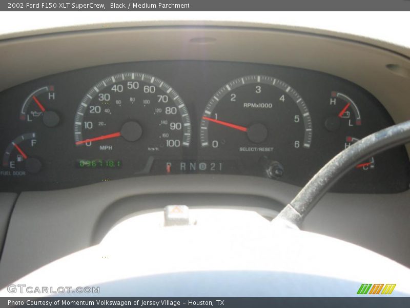 Black / Medium Parchment 2002 Ford F150 XLT SuperCrew