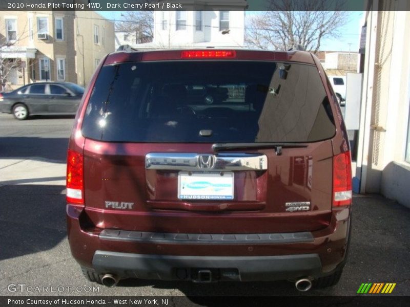Dark Cherry Pearl / Black 2010 Honda Pilot Touring 4WD