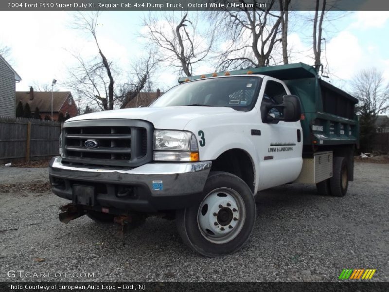 Front 3/4 View of 2004 F550 Super Duty XL Regular Cab 4x4 Dump Truck