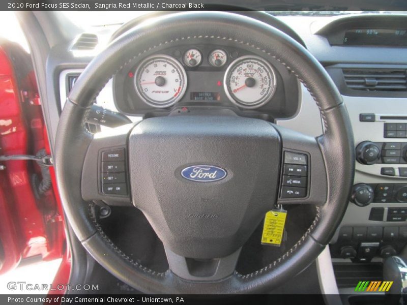 Sangria Red Metallic / Charcoal Black 2010 Ford Focus SES Sedan
