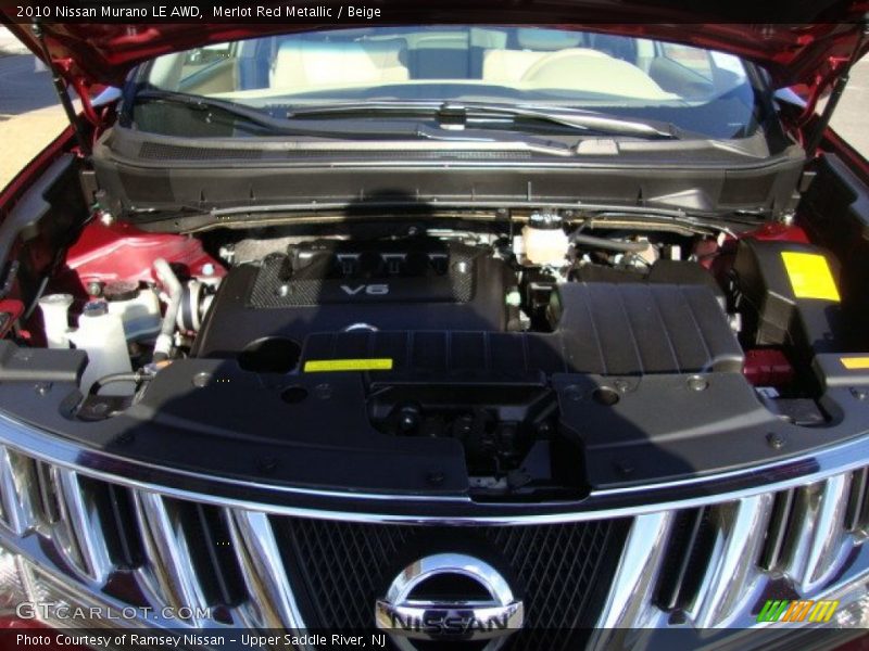 Merlot Red Metallic / Beige 2010 Nissan Murano LE AWD