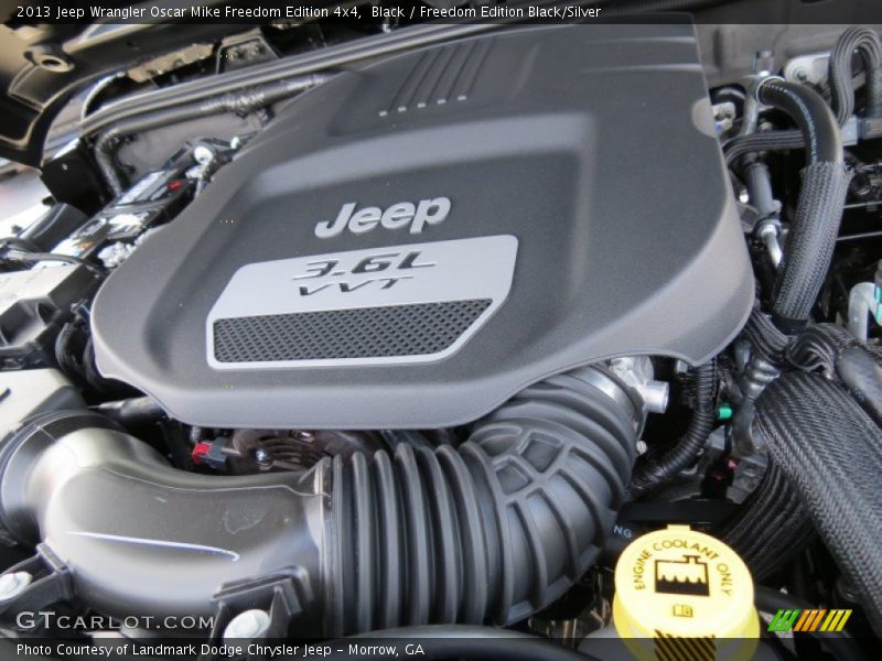 Black / Freedom Edition Black/Silver 2013 Jeep Wrangler Oscar Mike Freedom Edition 4x4