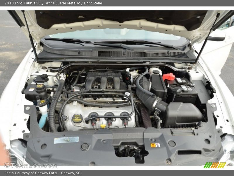 White Suede Metallic / Light Stone 2010 Ford Taurus SEL