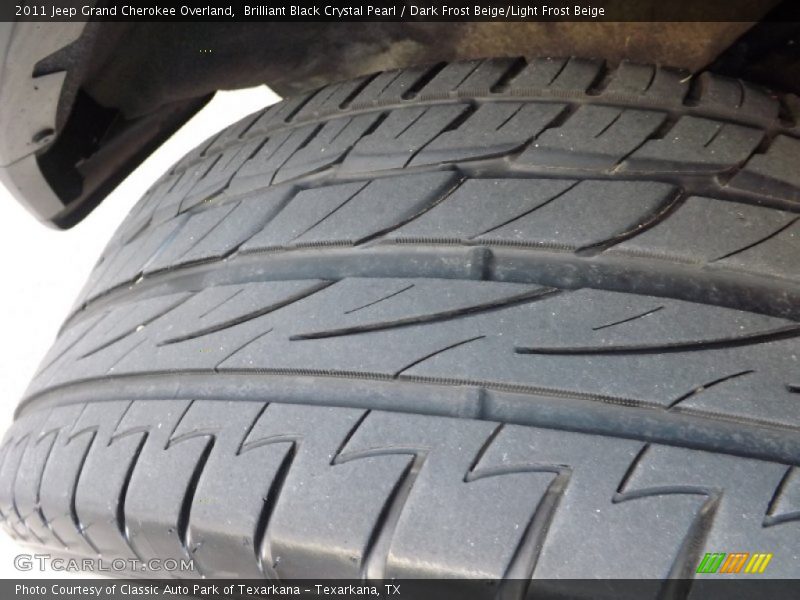 Brilliant Black Crystal Pearl / Dark Frost Beige/Light Frost Beige 2011 Jeep Grand Cherokee Overland