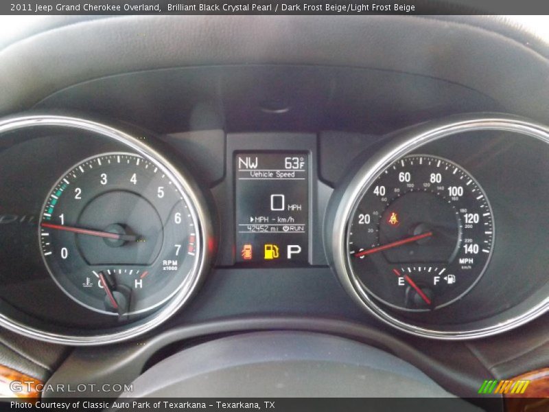 Brilliant Black Crystal Pearl / Dark Frost Beige/Light Frost Beige 2011 Jeep Grand Cherokee Overland