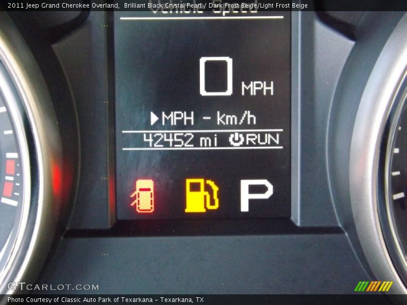 Brilliant Black Crystal Pearl / Dark Frost Beige/Light Frost Beige 2011 Jeep Grand Cherokee Overland