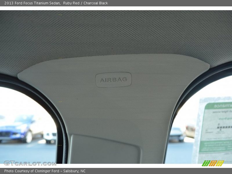 Ruby Red / Charcoal Black 2013 Ford Focus Titanium Sedan