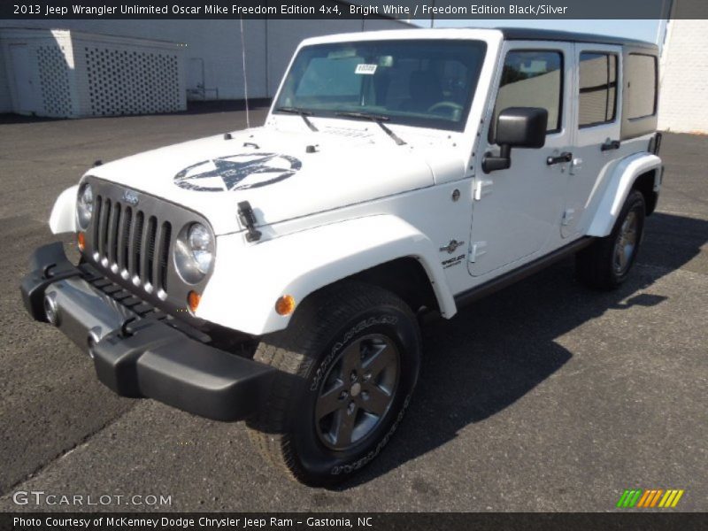 Front 3/4 View of 2013 Wrangler Unlimited Oscar Mike Freedom Edition 4x4