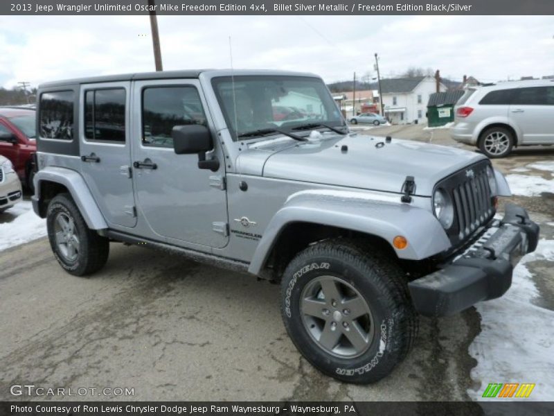 Front 3/4 View of 2013 Wrangler Unlimited Oscar Mike Freedom Edition 4x4