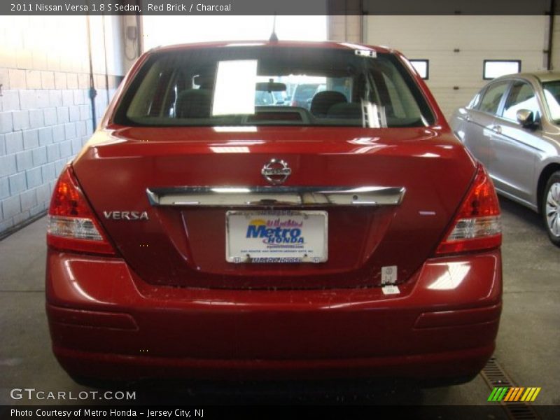 Red Brick / Charcoal 2011 Nissan Versa 1.8 S Sedan