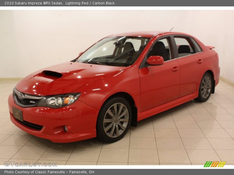 Lightning Red / Carbon Black 2010 Subaru Impreza WRX Sedan