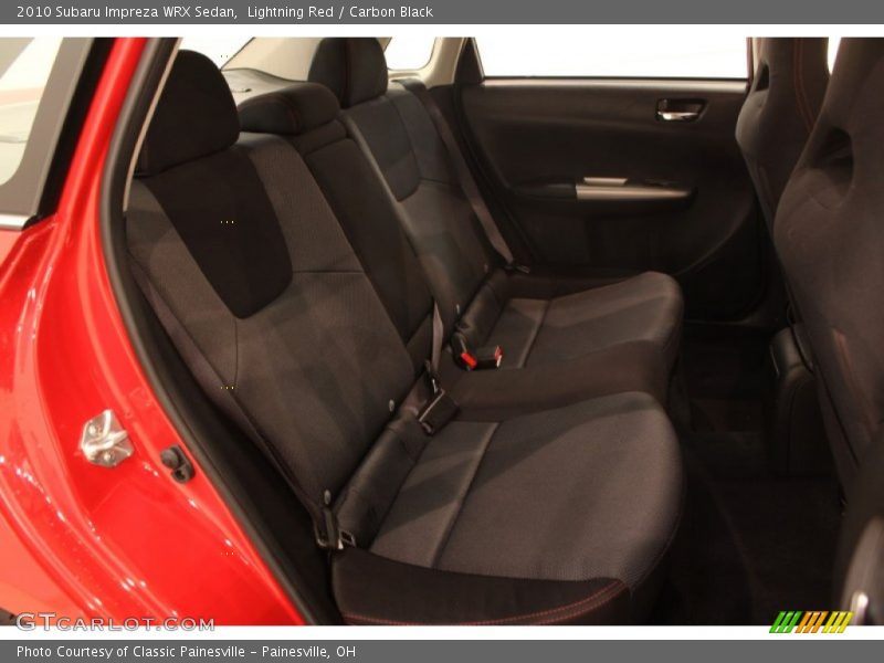 Lightning Red / Carbon Black 2010 Subaru Impreza WRX Sedan