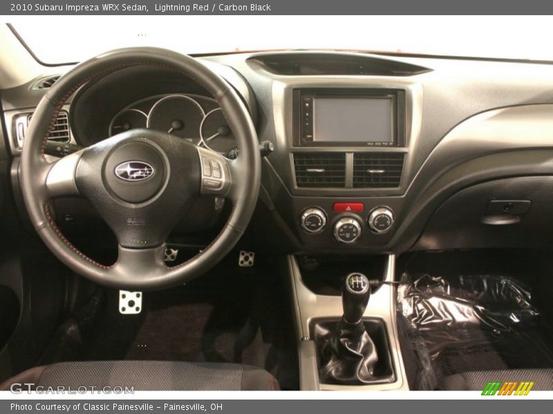 Lightning Red / Carbon Black 2010 Subaru Impreza WRX Sedan