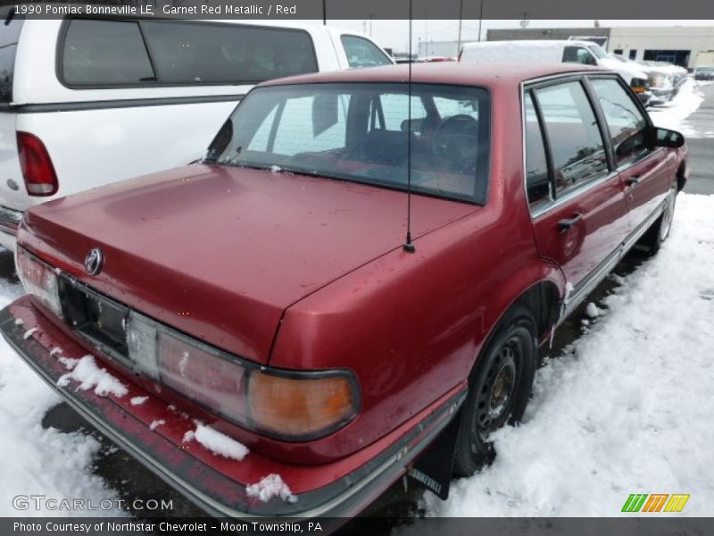 Garnet Red Metallic / Red 1990 Pontiac Bonneville LE