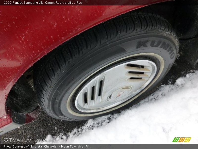 Garnet Red Metallic / Red 1990 Pontiac Bonneville LE