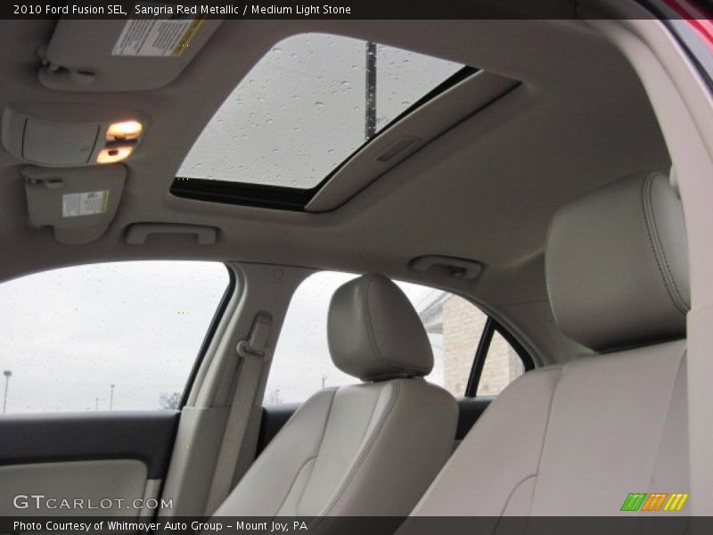 Sangria Red Metallic / Medium Light Stone 2010 Ford Fusion SEL