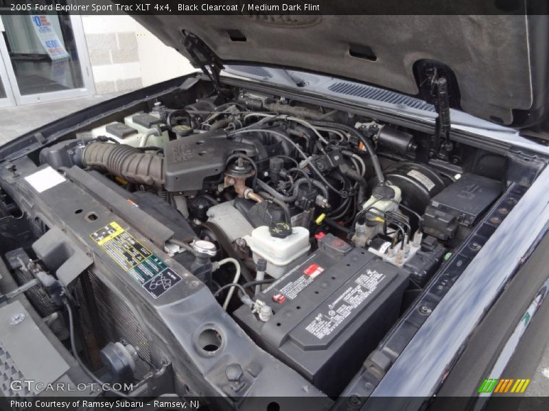 Black Clearcoat / Medium Dark Flint 2005 Ford Explorer Sport Trac XLT 4x4
