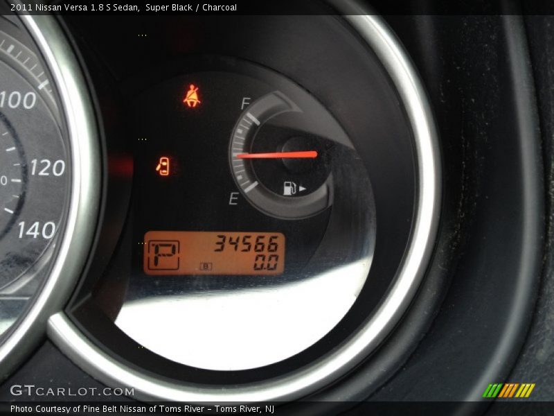 Super Black / Charcoal 2011 Nissan Versa 1.8 S Sedan