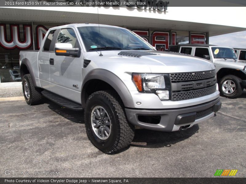 Front 3/4 View of 2011 F150 SVT Raptor SuperCab 4x4