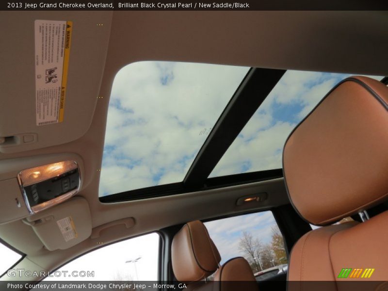 Brilliant Black Crystal Pearl / New Saddle/Black 2013 Jeep Grand Cherokee Overland