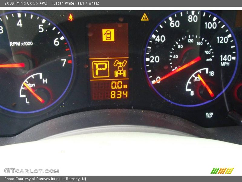 Tuscan White Pearl / Wheat 2009 Infiniti QX 56 4WD