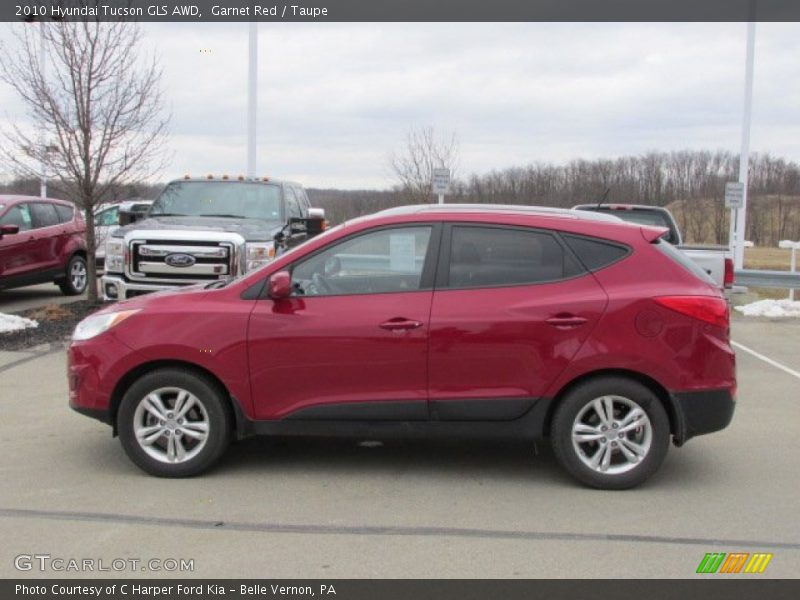 Garnet Red / Taupe 2010 Hyundai Tucson GLS AWD