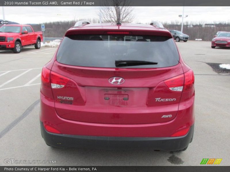 Garnet Red / Taupe 2010 Hyundai Tucson GLS AWD