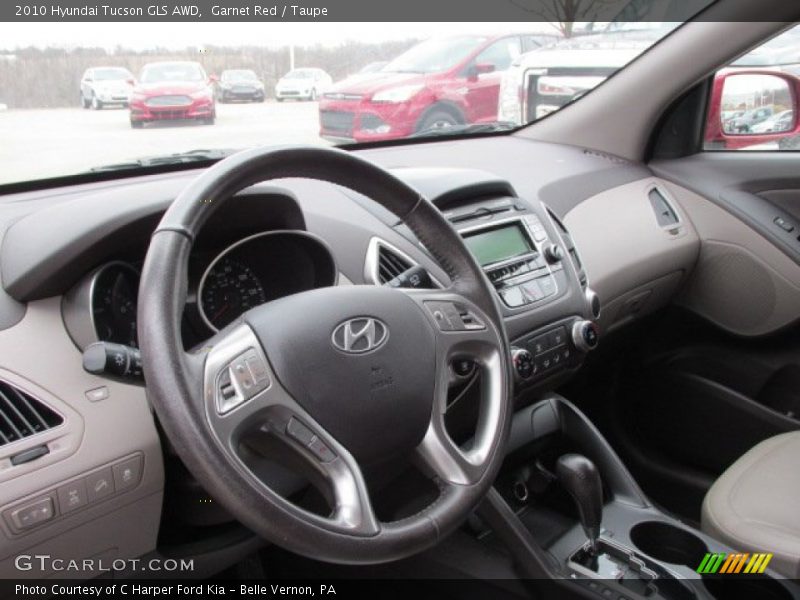 Garnet Red / Taupe 2010 Hyundai Tucson GLS AWD