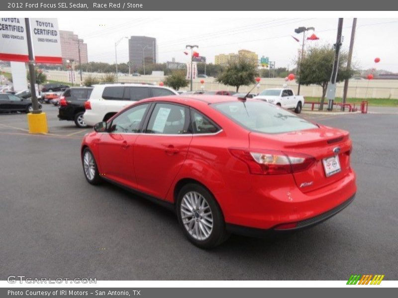 Race Red / Stone 2012 Ford Focus SEL Sedan