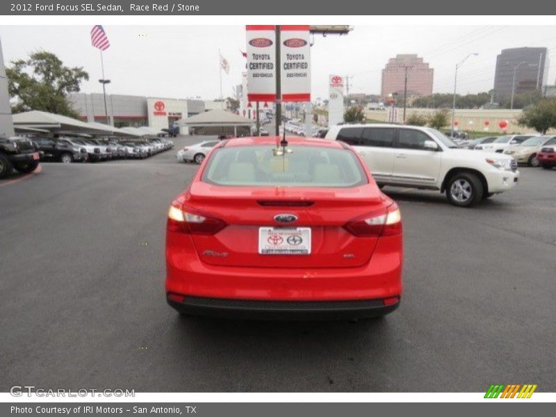 Race Red / Stone 2012 Ford Focus SEL Sedan