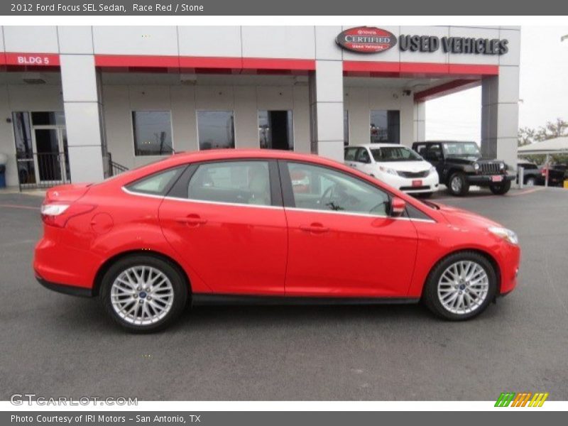 Race Red / Stone 2012 Ford Focus SEL Sedan