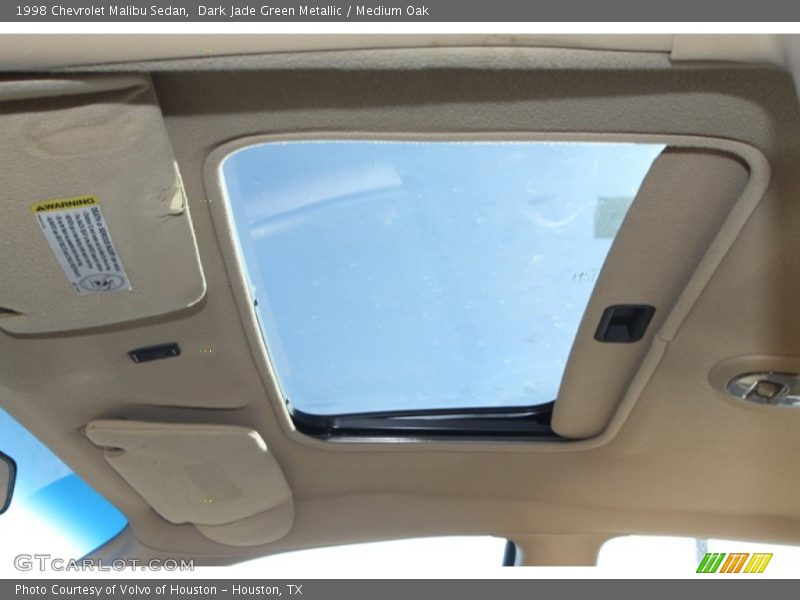 Dark Jade Green Metallic / Medium Oak 1998 Chevrolet Malibu Sedan