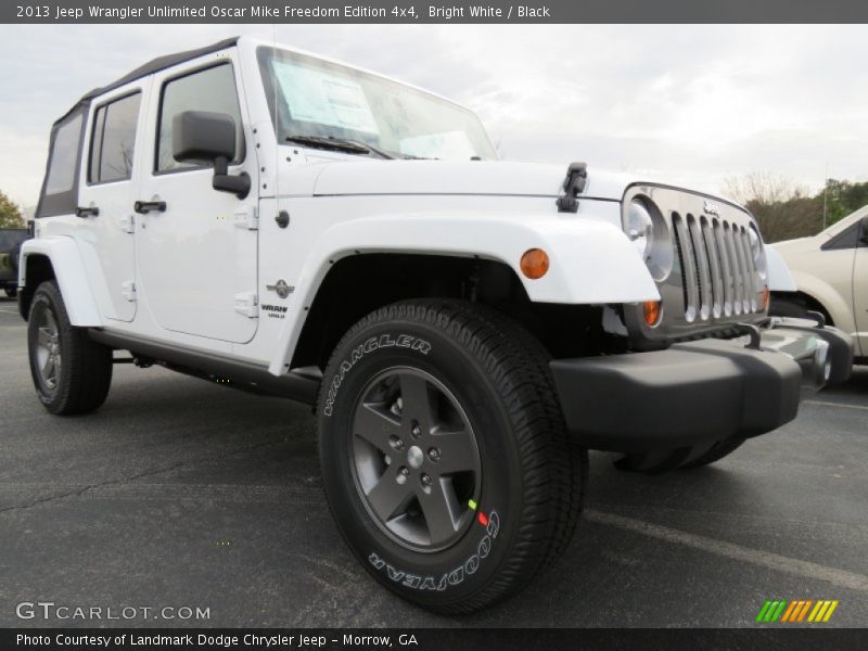 Front 3/4 View of 2013 Wrangler Unlimited Oscar Mike Freedom Edition 4x4