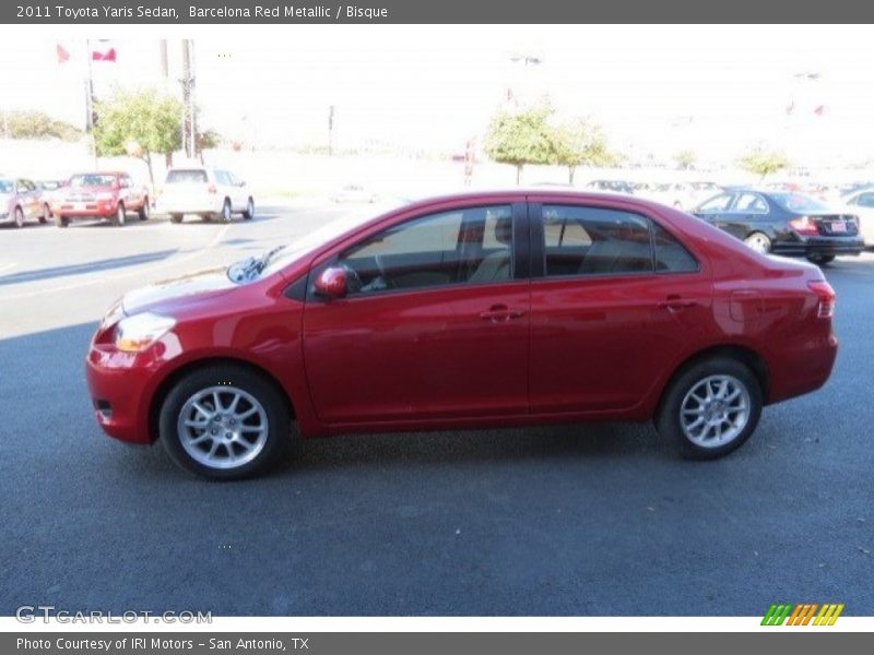 Barcelona Red Metallic / Bisque 2011 Toyota Yaris Sedan