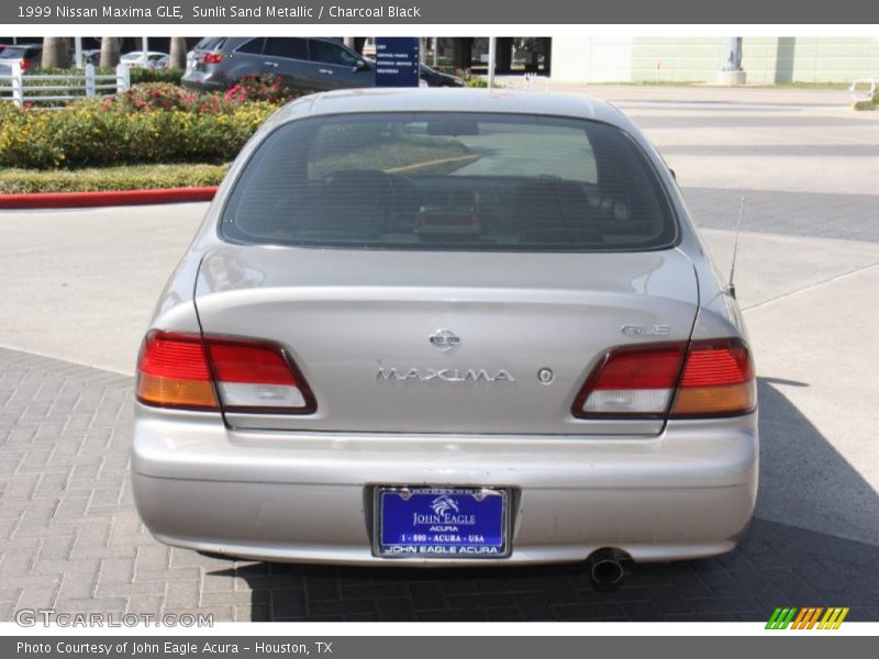 Sunlit Sand Metallic / Charcoal Black 1999 Nissan Maxima GLE