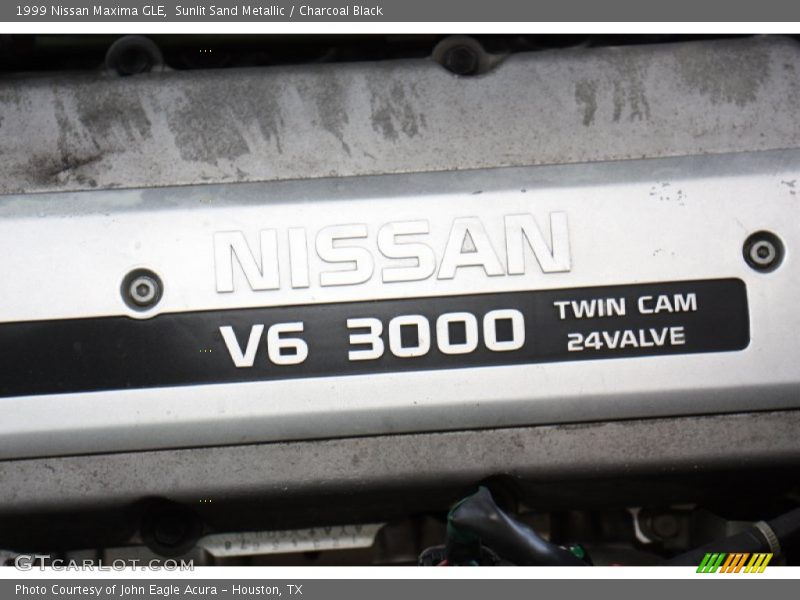 Sunlit Sand Metallic / Charcoal Black 1999 Nissan Maxima GLE