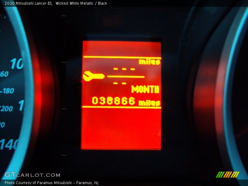 Wicked White Metallic / Black 2010 Mitsubishi Lancer ES