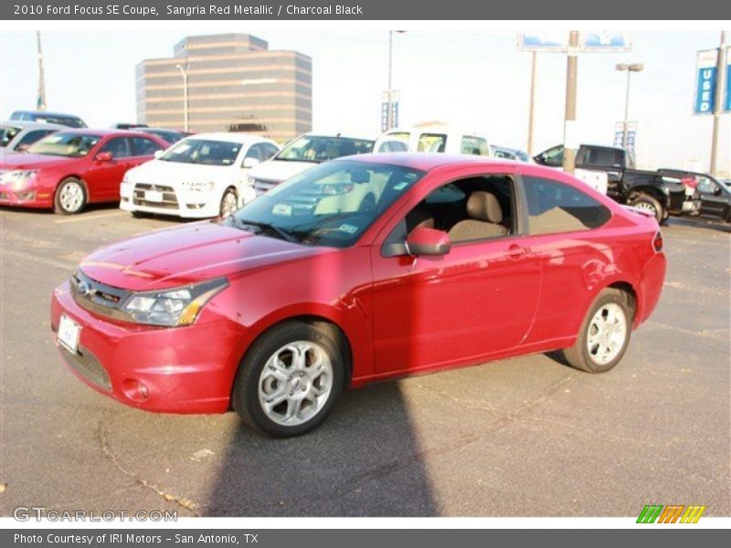 Sangria Red Metallic / Charcoal Black 2010 Ford Focus SE Coupe