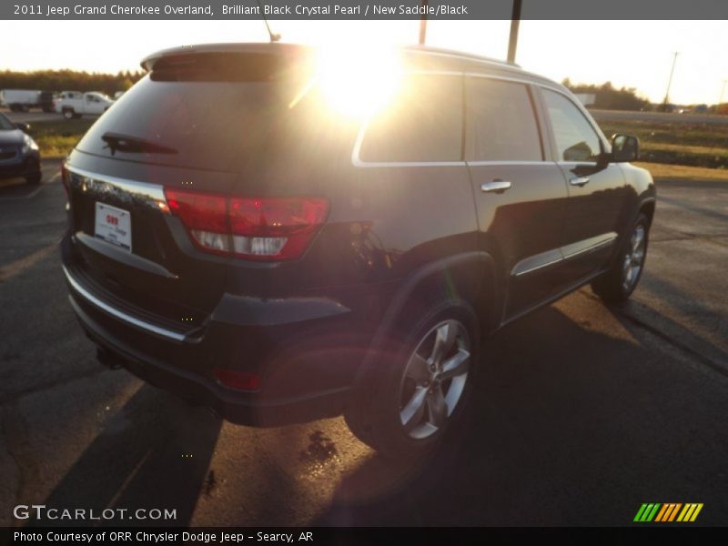 Brilliant Black Crystal Pearl / New Saddle/Black 2011 Jeep Grand Cherokee Overland