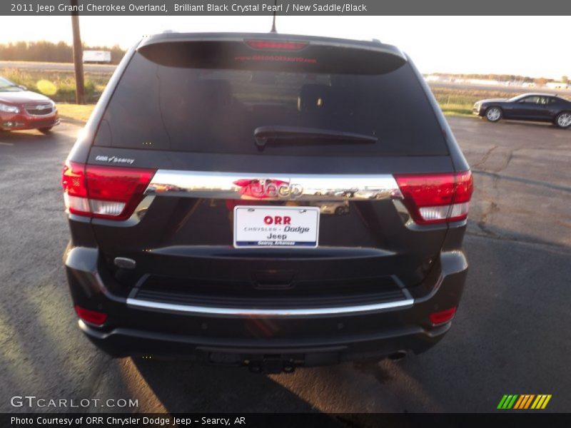 Brilliant Black Crystal Pearl / New Saddle/Black 2011 Jeep Grand Cherokee Overland