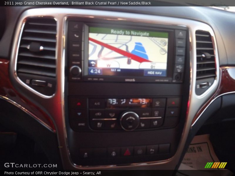 Brilliant Black Crystal Pearl / New Saddle/Black 2011 Jeep Grand Cherokee Overland