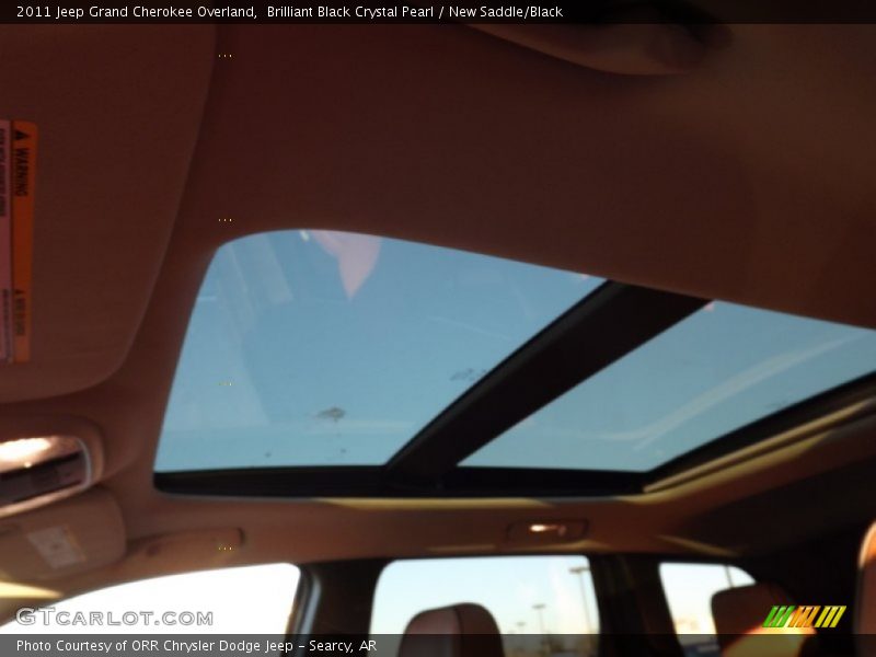 Brilliant Black Crystal Pearl / New Saddle/Black 2011 Jeep Grand Cherokee Overland