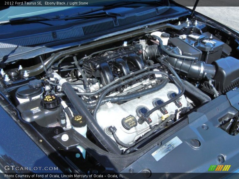 Ebony Black / Light Stone 2012 Ford Taurus SE