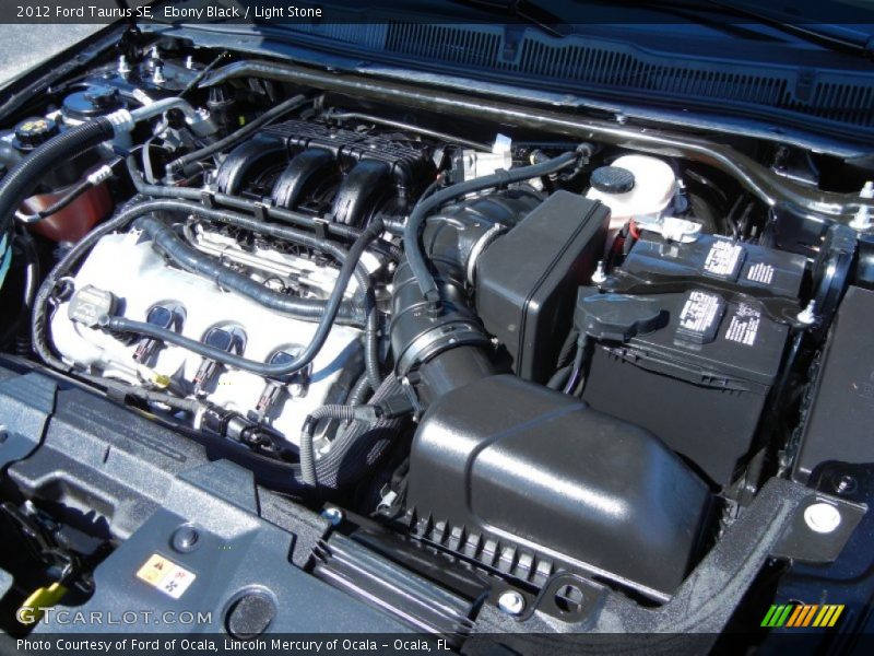 Ebony Black / Light Stone 2012 Ford Taurus SE