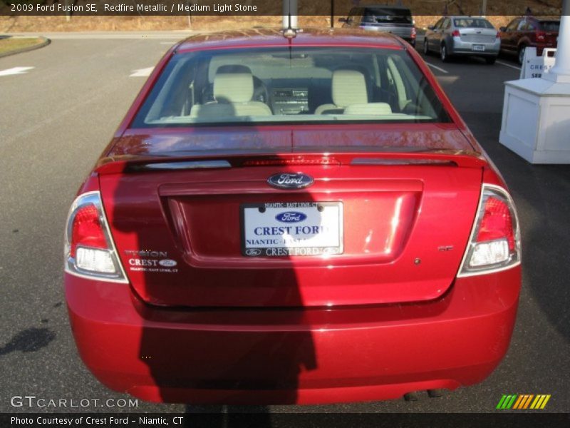 Redfire Metallic / Medium Light Stone 2009 Ford Fusion SE