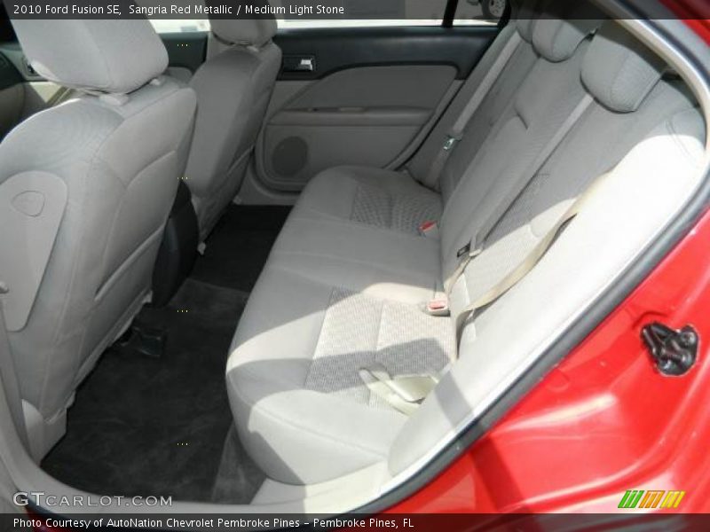 Sangria Red Metallic / Medium Light Stone 2010 Ford Fusion SE
