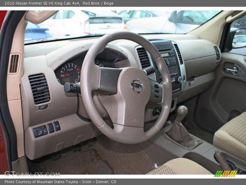 Red Brick / Beige 2010 Nissan Frontier SE V6 King Cab 4x4