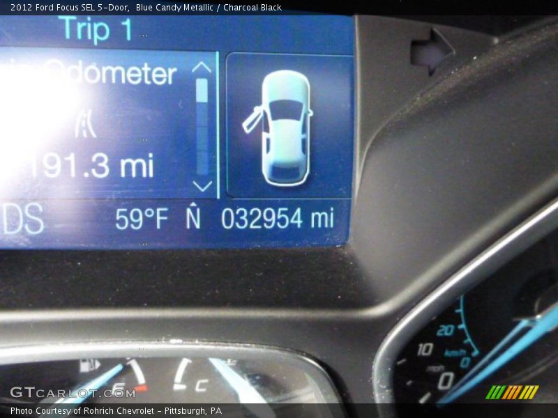 Blue Candy Metallic / Charcoal Black 2012 Ford Focus SEL 5-Door